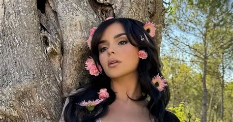 Demi Rose nearly spills out of tiny bikini as she shows off curves